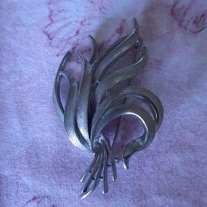 Alan J silver tone brooch
